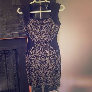 Form fitting black & gold dress